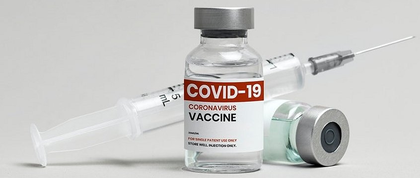 boccetta di vaccino vicina ad una siringa