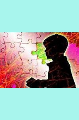 bambino di profilo su uno sfondo a tasselli di puzzle