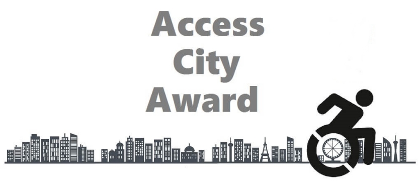 skyline di città e icona di uomo in carrozzina con scritto access city award 